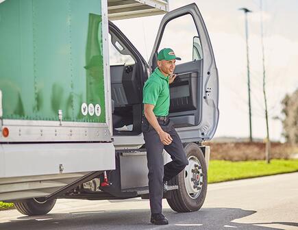 College hunk stepping out of moving truck