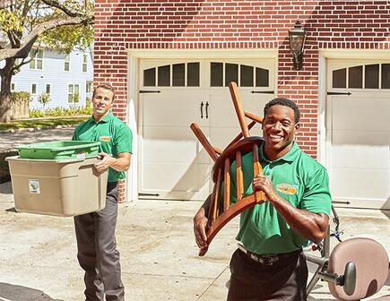 two college hunks moving household items